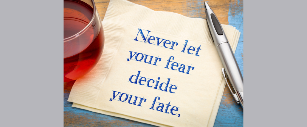 Never let fear decide your fate is written on a napkin